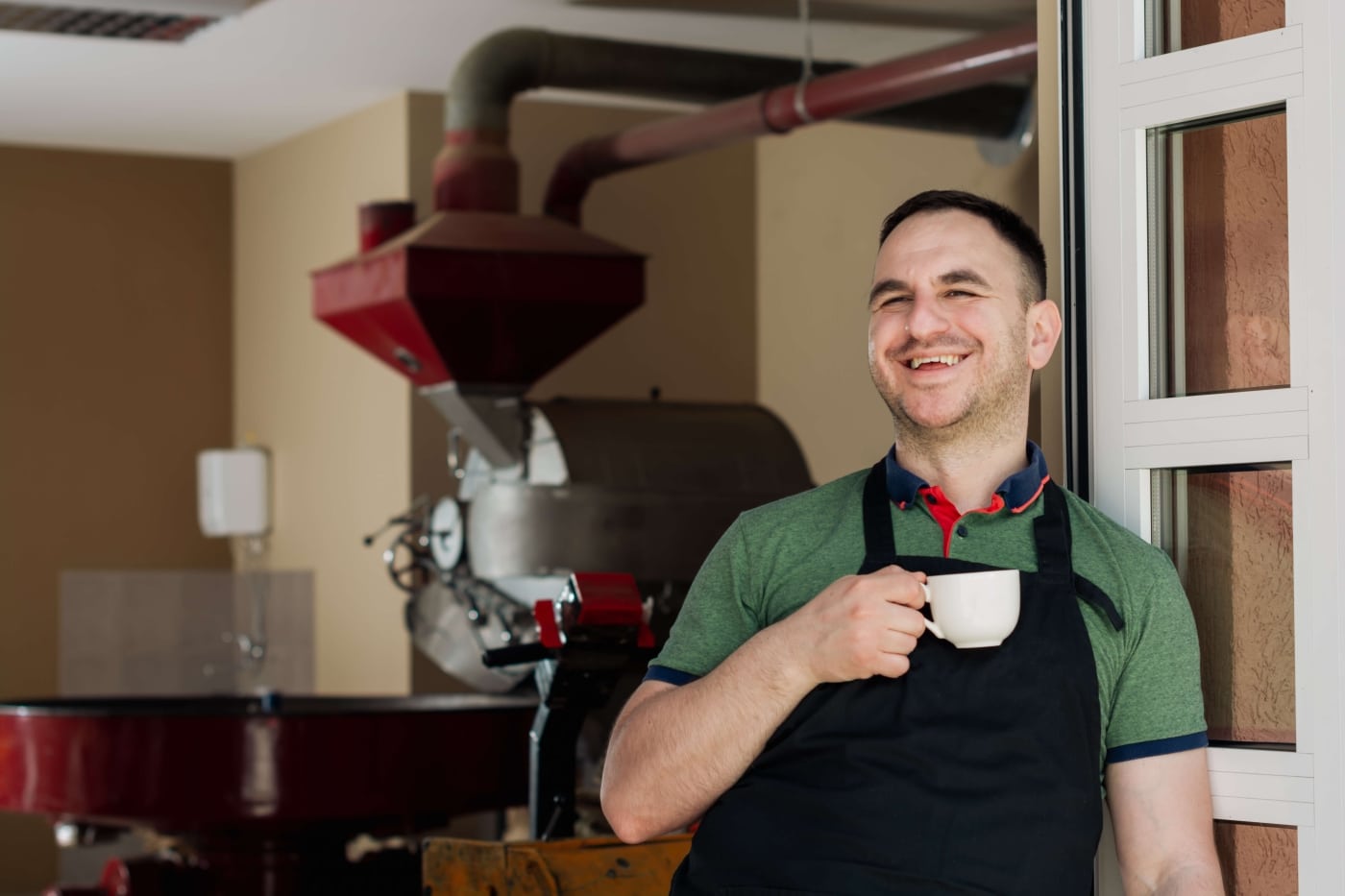 Man with coffee smiling