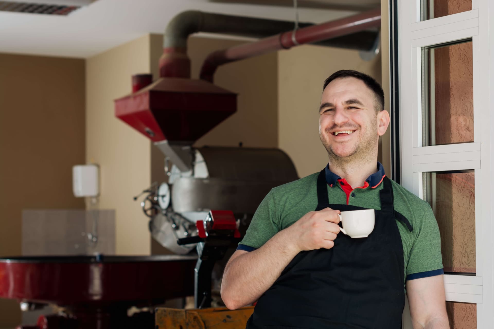 Man with coffee smiling