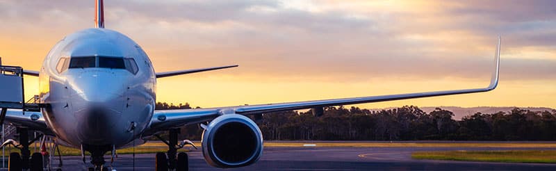 Aeroplane on the ground at sunset