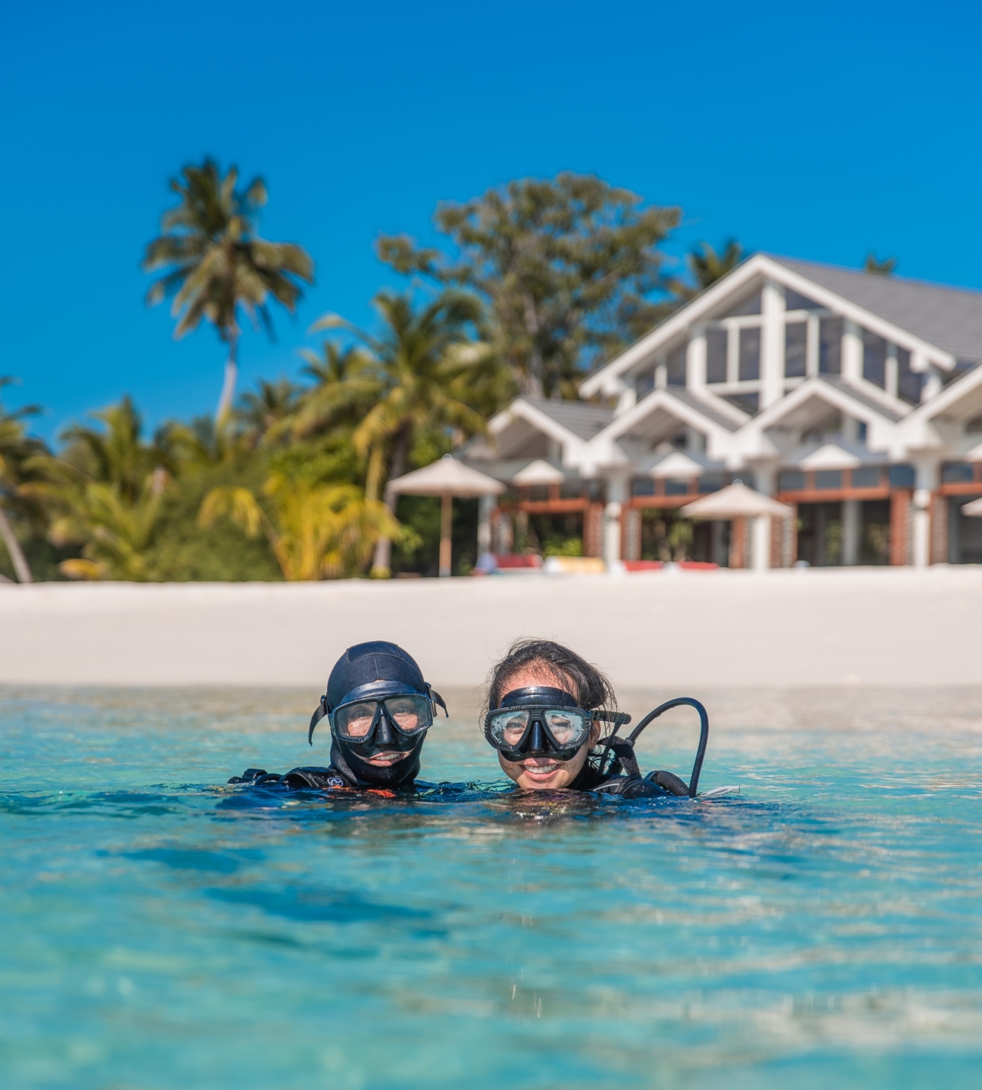 Couple scuba diving on their holiday in paradise